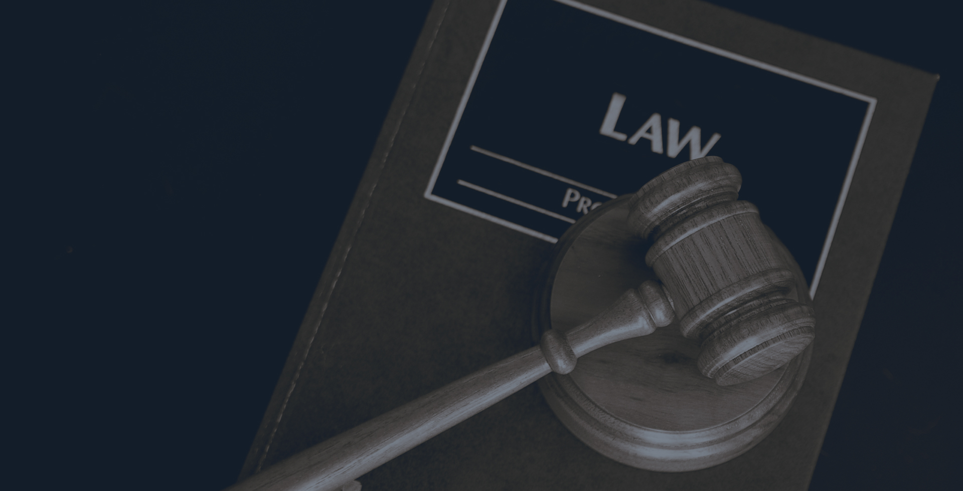 A judge’s gavel resting on a legal volume